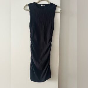 Reformation black tight dress with ruched sides. Size small.